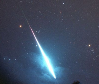 The photographer claims this is a Leonid meteor, but reall I think it's a space ship.  Or maybe a laser FROM a spaceship.  That's the REAL reason I watch at night.  Be sure to wear a tinfoil hat.